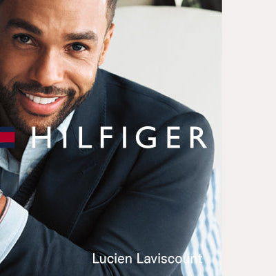 Model in old car wearing Tommy Hilfiger watch and bracelet