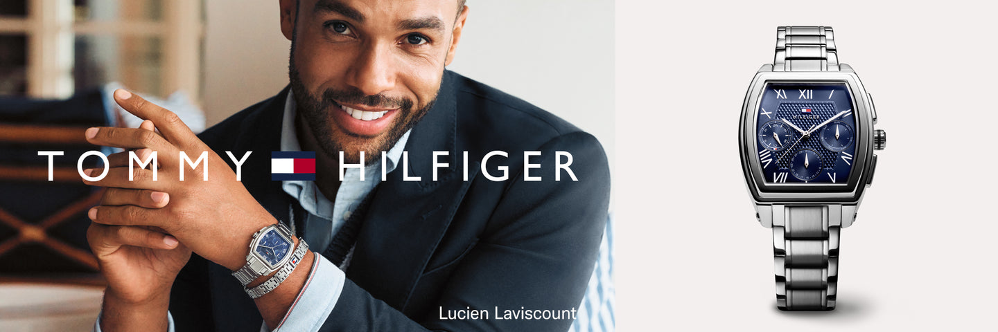 Tommy Hilfiger advertisement with a man wearing a watch and the brand logo.