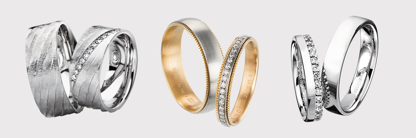 Three silver rings with different designs on a white background